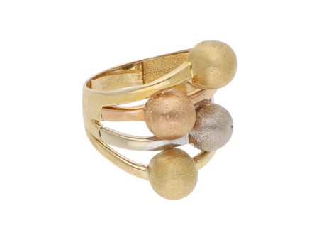 Anillo calado motivo esferas en oro tres tonos 14 kilates. Online now