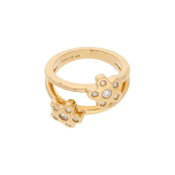 Anillo estilizado motivo flores con diamantes en oro amarillo 18 kilates. Fashion