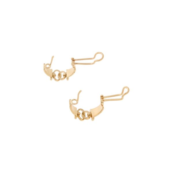 Aretes calados con diamantes en oro amarillo 14 kilates. Fashion